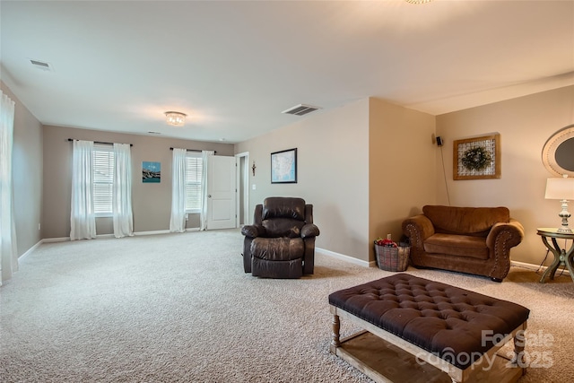 carpeted living room with baseboards