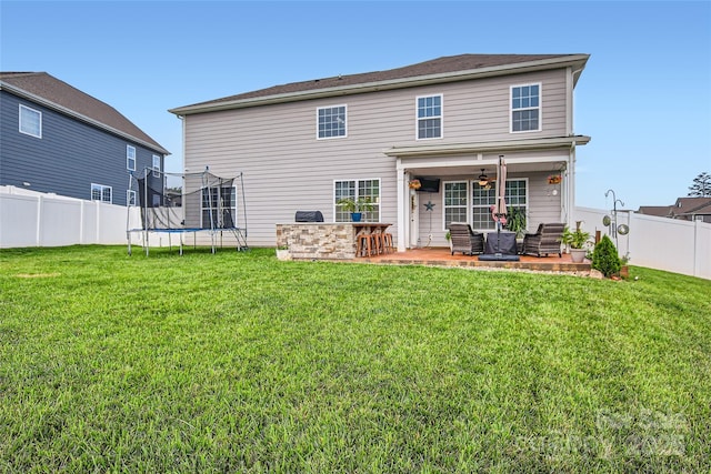 back of house featuring a patio area and a ceiling fan