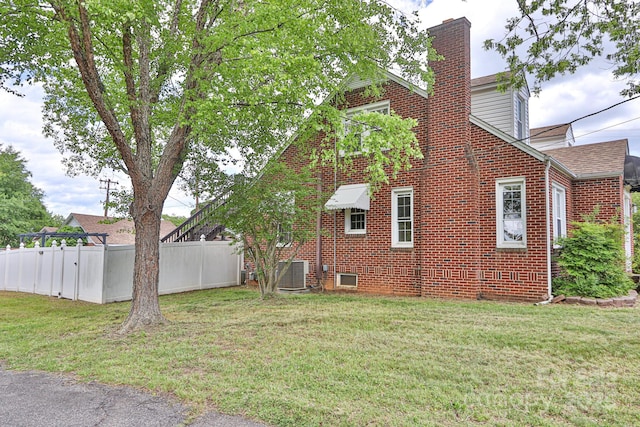 view of yard featuring central AC