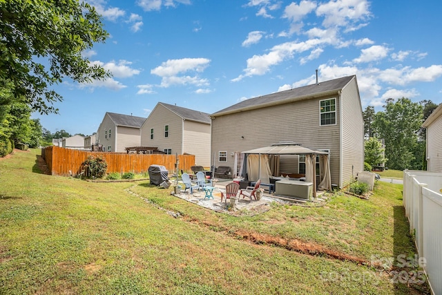 back of house featuring a gazebo and a patio area