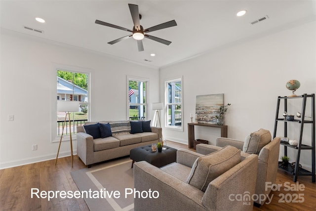 living room featuring ceiling fan, wood finished floors, baseboards, and recessed lighting