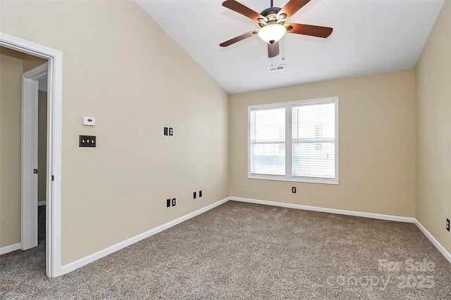 unfurnished room with vaulted ceiling, carpet flooring, a ceiling fan, and baseboards