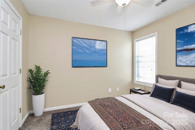 bedroom with baseboards, ceiling fan, and carpet