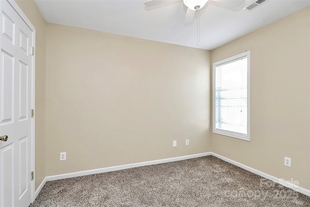 unfurnished room featuring carpet flooring, baseboards, and a ceiling fan