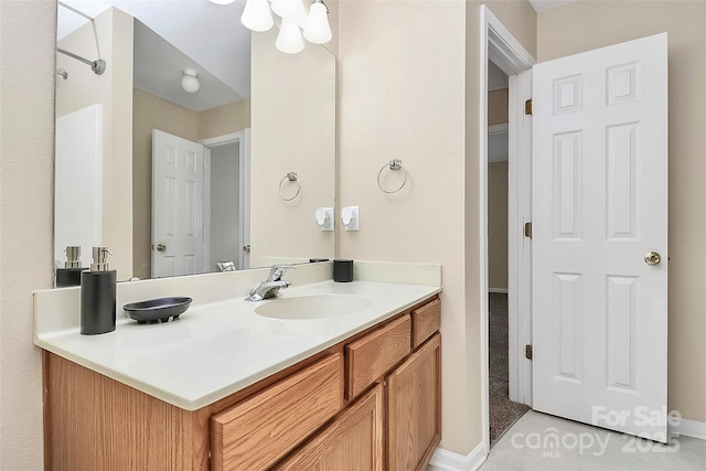 bathroom with vanity and baseboards