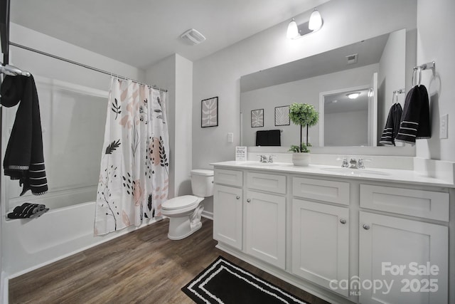 full bath featuring toilet, wood finished floors, double vanity, and shower / tub combo with curtain