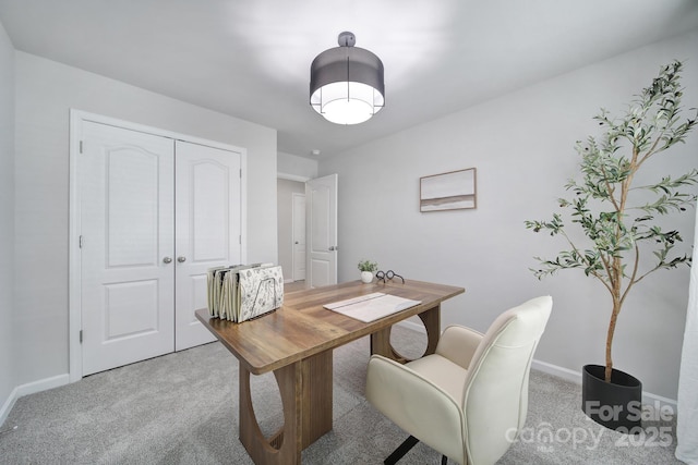 home office with light carpet and baseboards