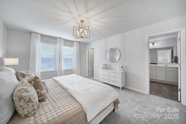 bedroom with a chandelier, carpet, connected bathroom, and baseboards