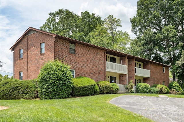 view of property featuring uncovered parking
