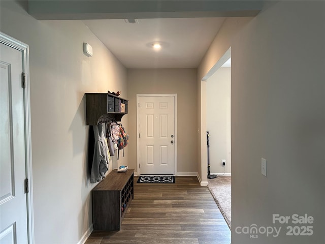 mudroom featuring dark wood-style floors and baseboards