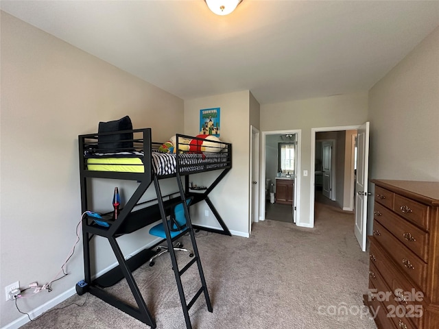 bedroom featuring baseboards and carpet