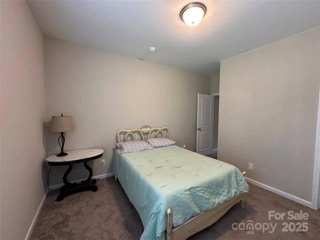 bedroom featuring carpet floors and baseboards