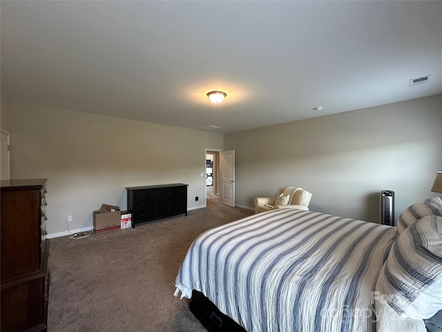 carpeted bedroom featuring baseboards