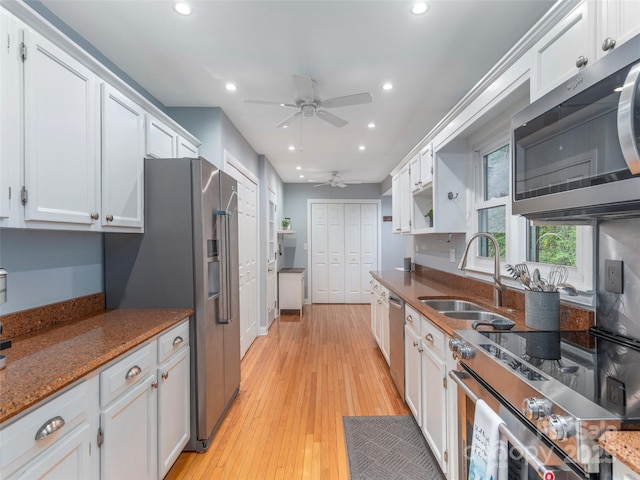 14 Bellewood Dr, Maggie Valley, NC 28751 - kitchen with stainless steel appliances, a ceiling fan, a sink, recessed lighting, and white cabinetry