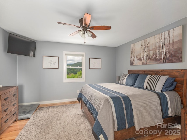 14 Bellewood Dr, Maggie Valley, NC 28751 - bedroom with light wood-style flooring, baseboards, and a ceiling fan