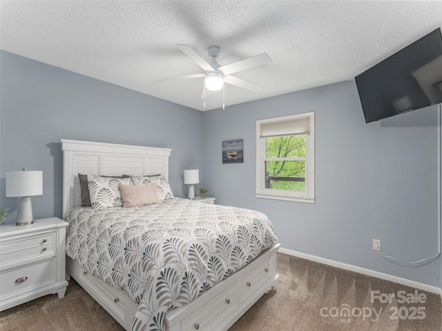 14 Bellewood Dr, Maggie Valley, NC 28751 - bedroom featuring dark carpet, baseboards, a textured ceiling, and ceiling fan