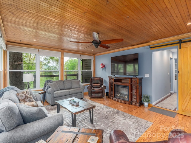 14 Bellewood Dr, Maggie Valley, NC 28751 - living room featuring a barn door, wooden ceiling, healthy amount of natural light, ceiling fan, and wood finished floors