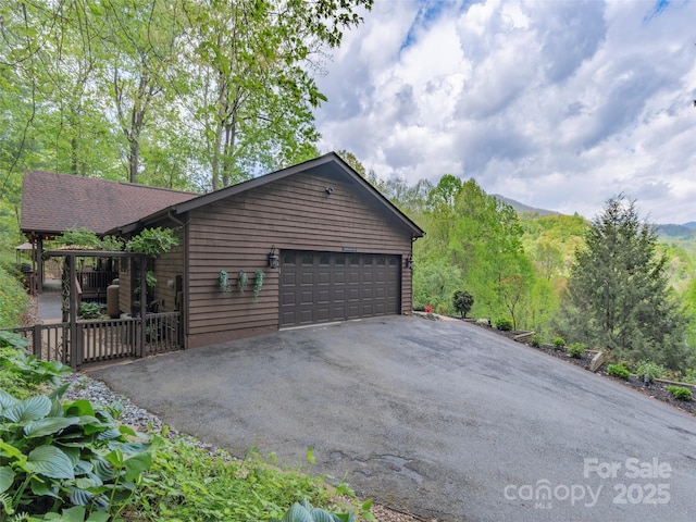 14 Bellewood Dr, Maggie Valley, NC 28751 - view of side of home featuring driveway and an attached garage