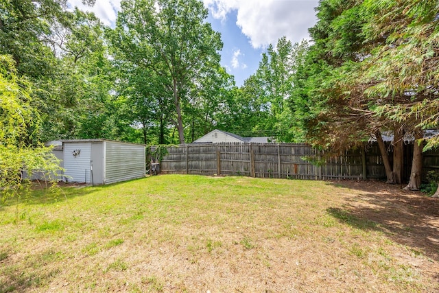 view of yard with an outbuilding and a storage unit