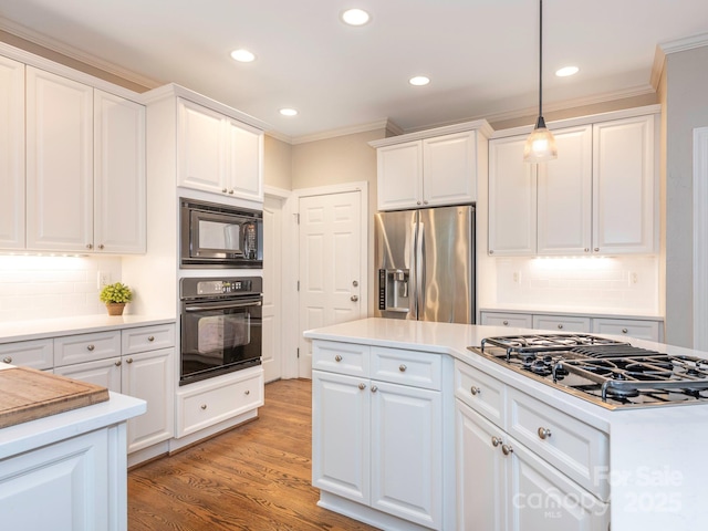 7040 Edenderry Dr, Charlotte, NC 28270 - kitchen featuring black appliances, white cabinetry, recessed lighting, crown molding, and decorative backsplash