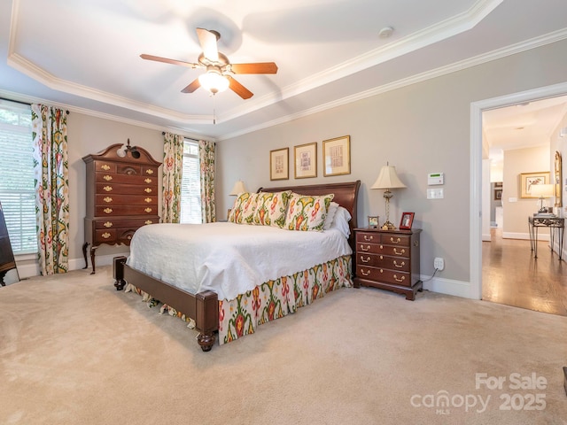 7040 Edenderry Dr, Charlotte, NC 28270 - carpeted bedroom with a raised ceiling, crown molding, a ceiling fan, and baseboards