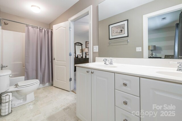 7040 Edenderry Dr, Charlotte, NC 28270 - bathroom featuring double vanity, toilet, and shower / bath combo with shower curtain