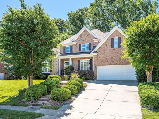 7040 Edenderry Dr, Charlotte, NC 28270 - traditional-style home featuring brick siding, driveway, a garage, and a front lawn