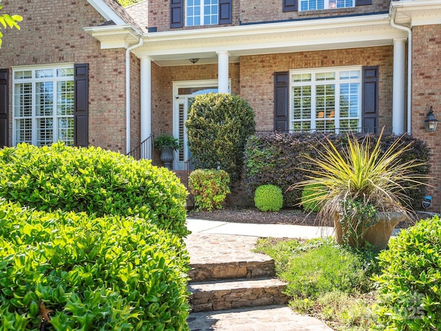 7040 Edenderry Dr, Charlotte, NC 28270 - property entrance with covered porch and brick siding