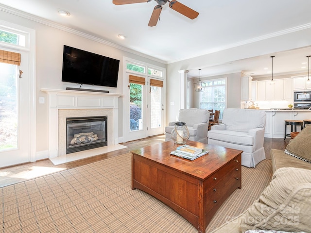 7040 Edenderry Dr, Charlotte, NC 28270 - living area featuring ornamental molding, ceiling fan, recessed lighting, a fireplace, and light wood-style flooring