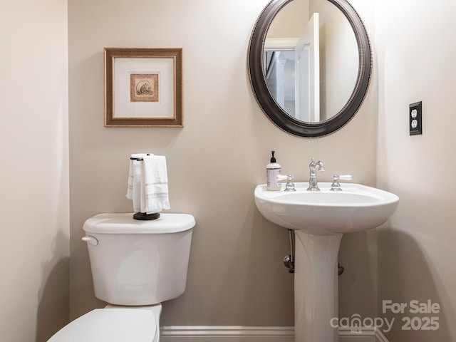 7040 Edenderry Dr, Charlotte, NC 28270 - bathroom with toilet, a sink, and baseboards