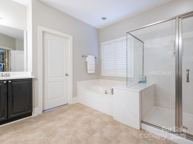 7040 Edenderry Dr, Charlotte, NC 28270 - full bathroom with a stall shower, a garden tub, vanity, and tile patterned flooring