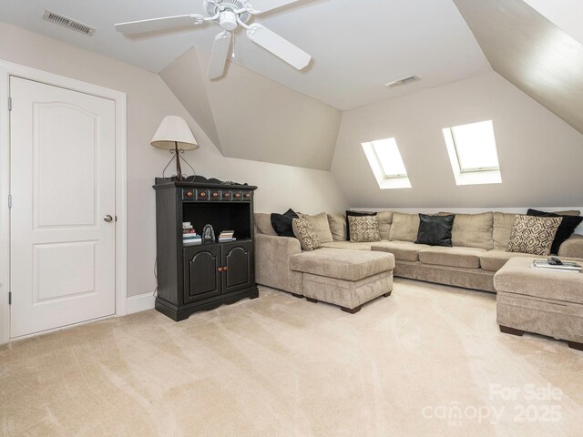 7040 Edenderry Dr, Charlotte, NC 28270 - living area featuring carpet flooring, vaulted ceiling, a skylight, a ceiling fan, and baseboards