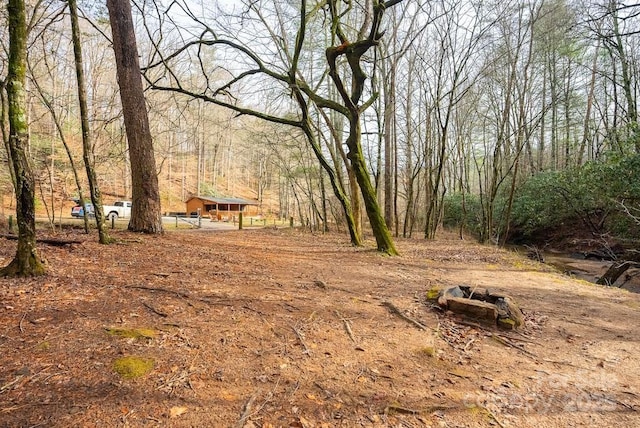 view of yard with a forest view
