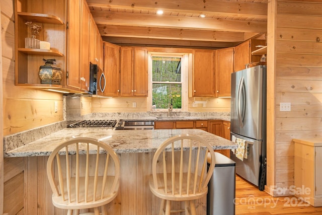 60 Laurel Ln, Mars Hill, NC 28754 - kitchen featuring open shelves, appliances with stainless steel finishes, a sink, a peninsula, and light wood-style flooring