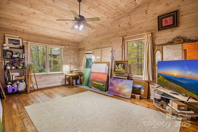 60 Laurel Ln, Mars Hill, NC 28754 - playroom featuring vaulted ceiling, wooden walls, hardwood / wood-style floors, healthy amount of natural light, and a ceiling fan