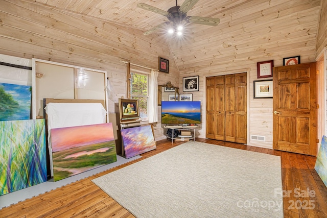 60 Laurel Ln, Mars Hill, NC 28754 - living room with wood walls, ceiling fan, lofted ceiling, hardwood / wood-style flooring, and wooden ceiling