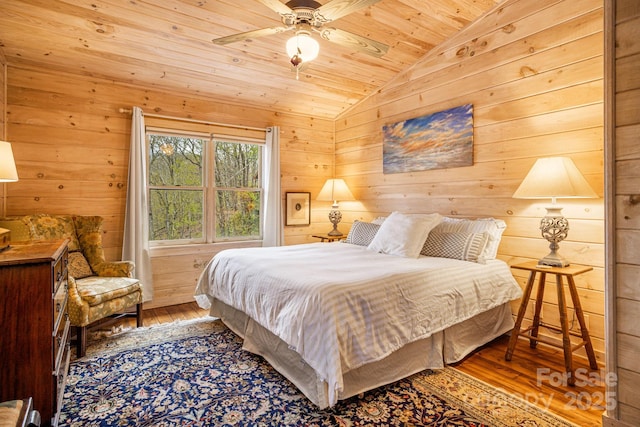 60 Laurel Ln, Mars Hill, NC 28754 - bedroom with vaulted ceiling, hardwood / wood-style flooring, wood ceiling, wooden walls, and ceiling fan