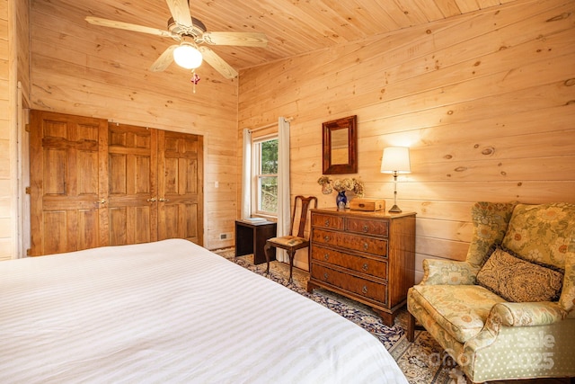 60 Laurel Ln, Mars Hill, NC 28754 - bedroom with wooden walls, wooden ceiling, a closet, and a ceiling fan