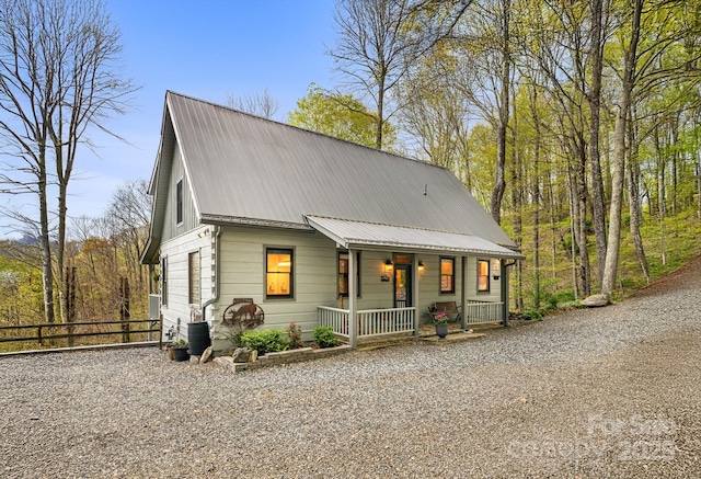 60 Laurel Ln, Mars Hill, NC 28754 - view of front of house featuring covered porch, metal roof, fence, and driveway