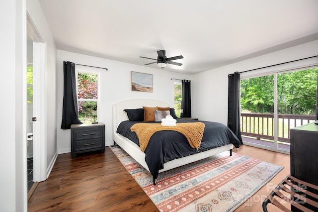 25 Licklog Ridge Rd, Fairview, NC 28730 - bedroom featuring access to exterior, wood finished floors, multiple windows, and a ceiling fan