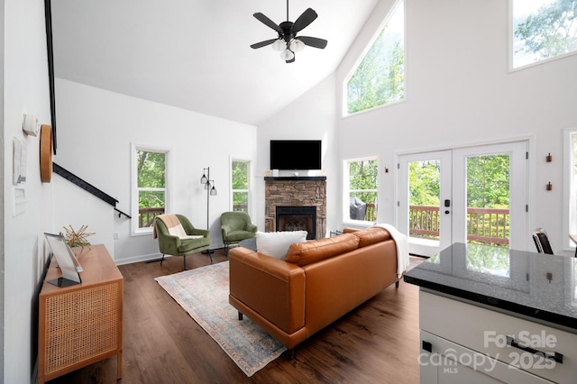 25 Licklog Ridge Rd, Fairview, NC 28730 - living room with high vaulted ceiling, ceiling fan, a fireplace, dark wood-style flooring, and baseboards