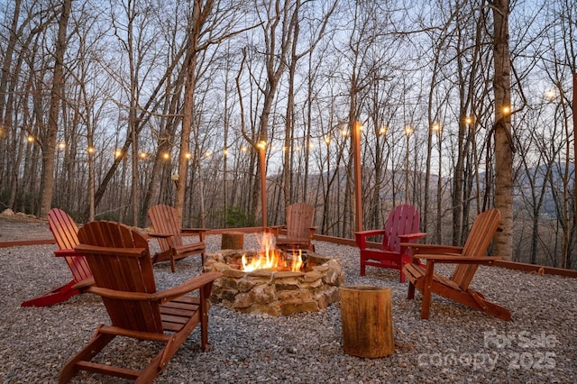 25 Licklog Ridge Rd, Fairview, NC 28730 - patio terrace at dusk featuring a fire pit