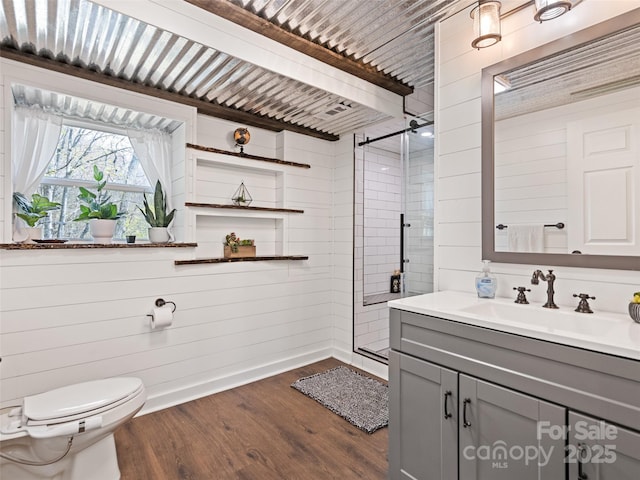 16 Sutton Knob Rd, Maggie Valley, NC 28751 - bathroom featuring a shower stall, wood finished floors, vanity, and toilet