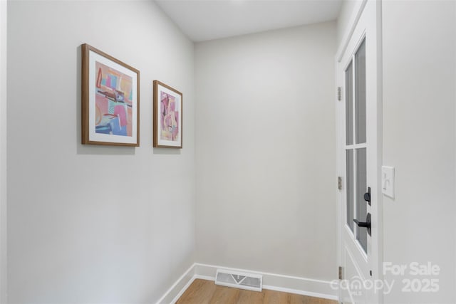 4042 Uppergate Ln, Charlotte, NC 28215 - hallway featuring light wood finished floors and baseboards