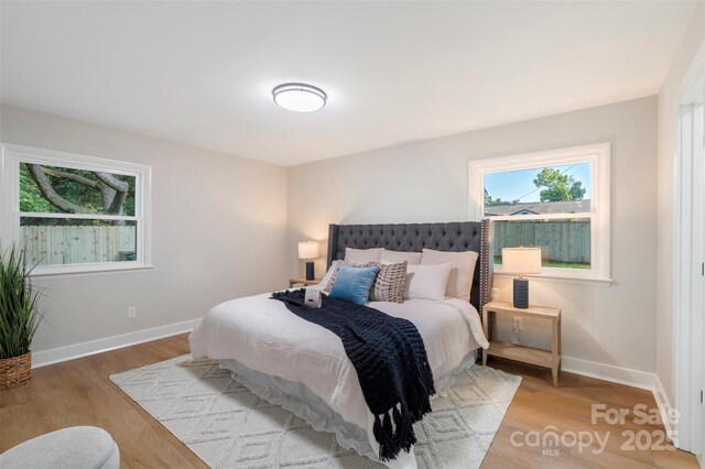 4042 Uppergate Ln, Charlotte, NC 28215 - bedroom with wood finished floors and baseboards