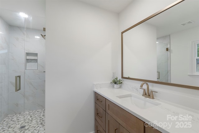 4042 Uppergate Ln, Charlotte, NC 28215 - full bathroom with vanity and a marble finish shower