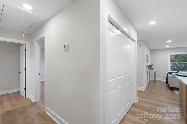 4042 Uppergate Ln, Charlotte, NC 28215 - corridor with attic access, light wood-style floors, baseboards, and recessed lighting