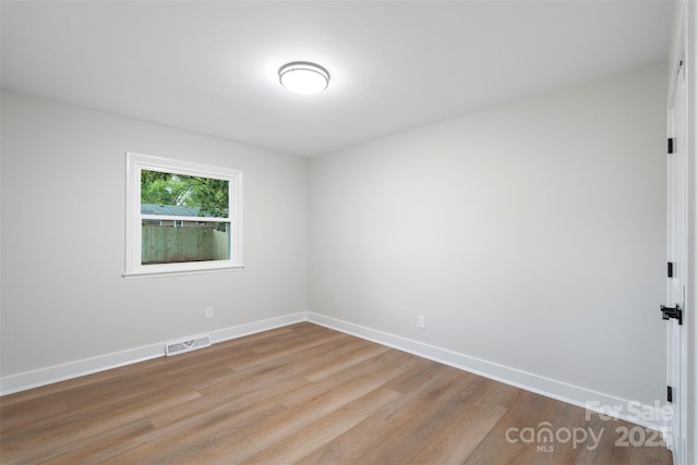 4042 Uppergate Ln, Charlotte, NC 28215 - spare room with wood finished floors and baseboards