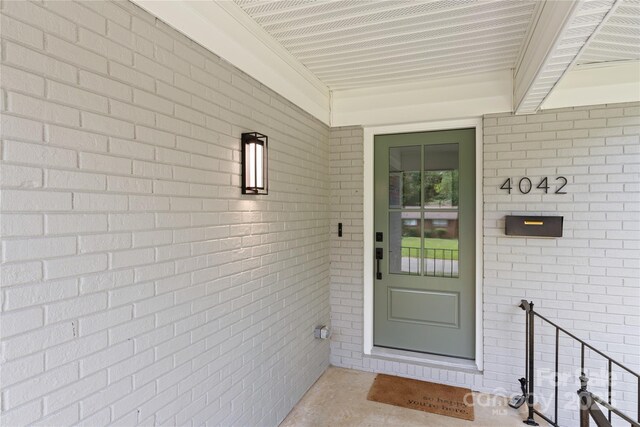 4042 Uppergate Ln, Charlotte, NC 28215 - view of exterior entry featuring brick siding