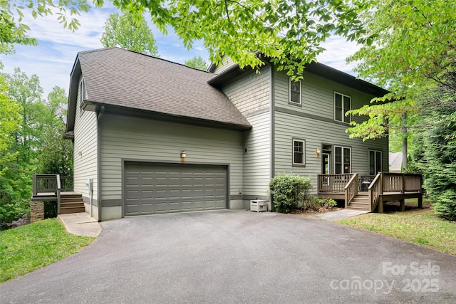 4 Yellow Owl Ct, Biltmore Lake, NC 28715 - view of front of house featuring asphalt driveway, a wooden deck, a shingled roof, and a garage